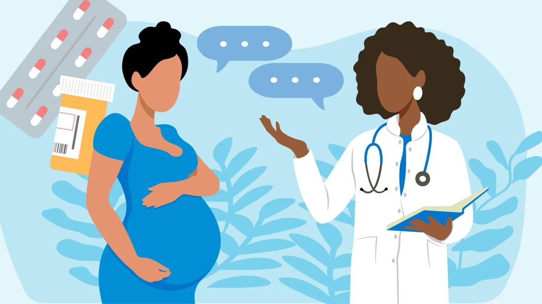 Pregnant woman discusses medications with her physician