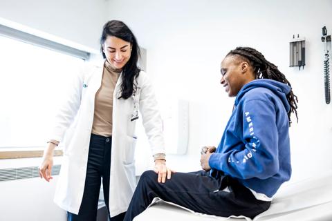 Dr. Littlejohn with patient in clinic