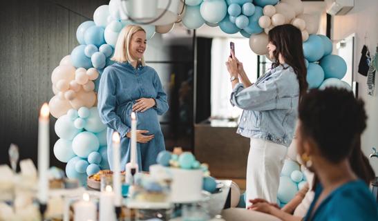 Pregnant woman and friends at her baby shower