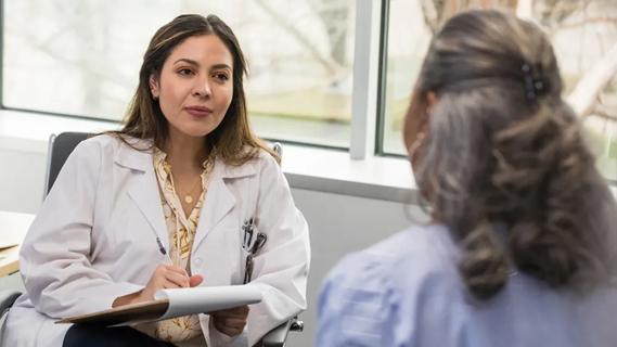 Clinician talking with patient